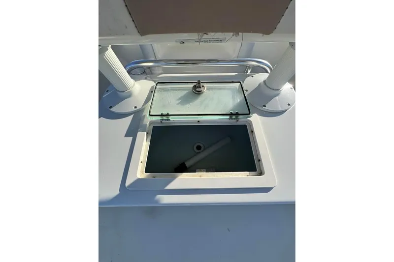 Slide: The Image of Open storage compartment on 2019 Parker 2501 Center Console boat. - 13