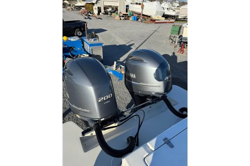 Slide: The Image of Twin Yamaha 200 outboard engines on a 2019 Parker 2501 Center Console boat. - 16
