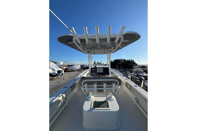 Slide: The Image of 2019 Parker 2501 Center Console boat with rod holders and navigation equipment. - 3
