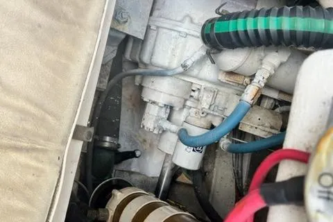 Slide: The Image of Engine compartment of a 1997 Henriques 38 El Bravo with hoses and cables. - 15