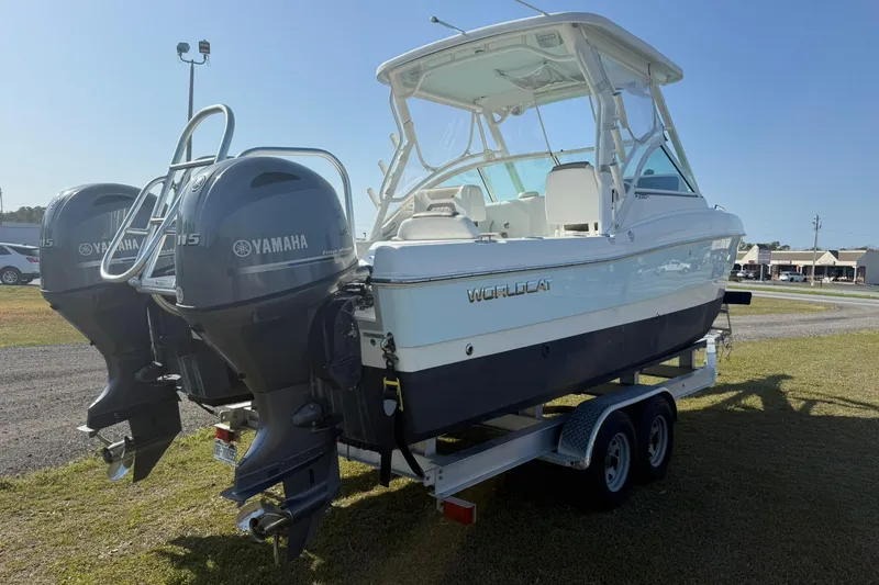 Slide: The Image of 2023 World Cat 230 DC boat with dual Yamaha engines on a trailer. - 20