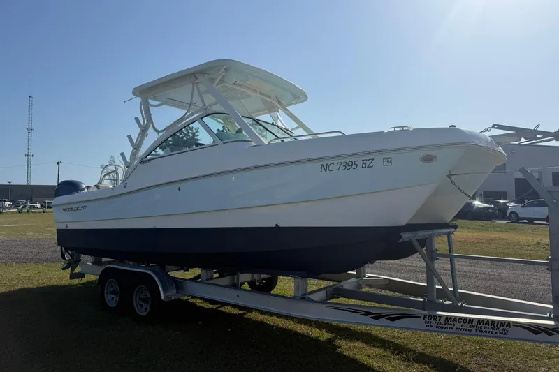 Slide: The Image of 2023 World Cat 230 DC boat on trailer at Fort Macon Marina, sunny day. - 22