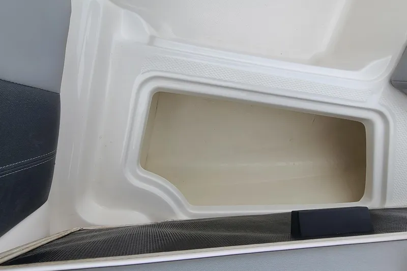 Slide: The Image of Interior storage compartment of a 2020 Chaparral 21 SSi OB boat. - 12