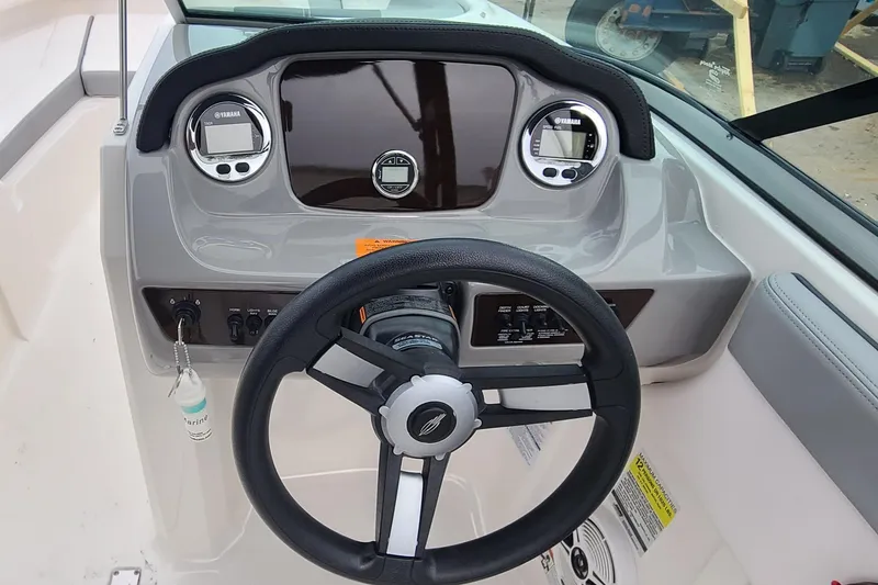 Slide: The Image of 2020 Chaparral 21 SSi OB boat dashboard with steering wheel and Yamaha gauges. - 13