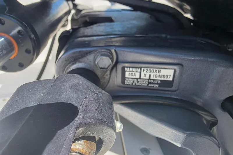 Slide: The Image of Close-up of Yamaha F200XB engine part on 2020 Chaparral 21 SSi OB boat. - 23