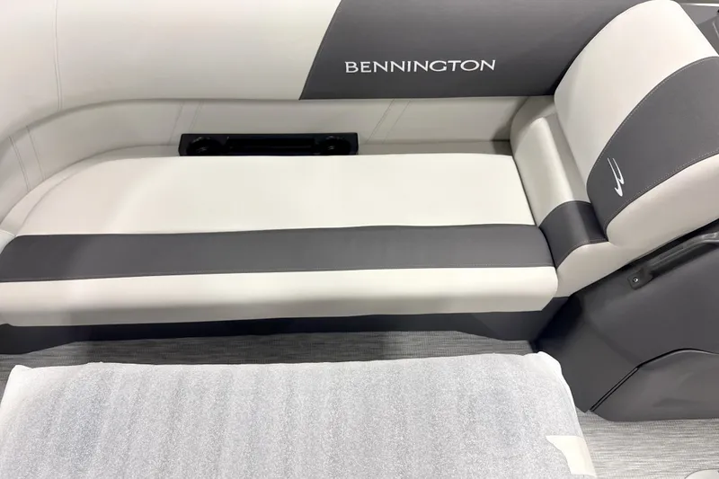 Slide: The Image of 2026 Bennington 22 S Quad Bench with sleek gray and white seating design. - 3