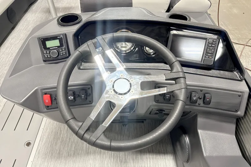 Slide: The Image of Steering console of 2026 Bennington 22 S Quad Bench with modern controls and displays. - 6
