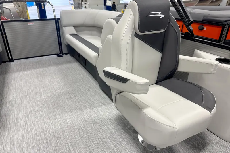 Slide: The Image of 2026 Bennington 22 S Quad Bench interior with luxurious seating and modern design. - 9