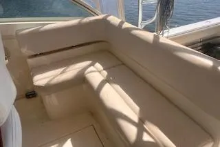 Slide: The Image of 2008 Albemarle 360 Express Fisherman boat interior with beige seating and ocean view. - 19