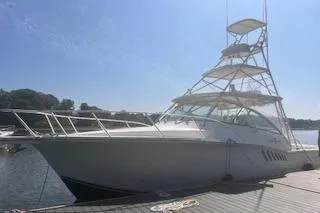 Slide: The Image of 2008 Albemarle 360 Express Fisherman boat docked under clear blue sky. - 2