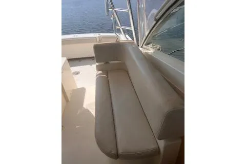 Slide: The Image of 2008 Albemarle 360 Express Fisherman boat interior with cushioned seating and ocean view. - 20
