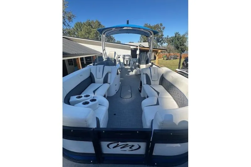 Slide: The Image of 2020 Manitou 25 X-Plode RFW pontoon boat with spacious seating and modern design. - 10
