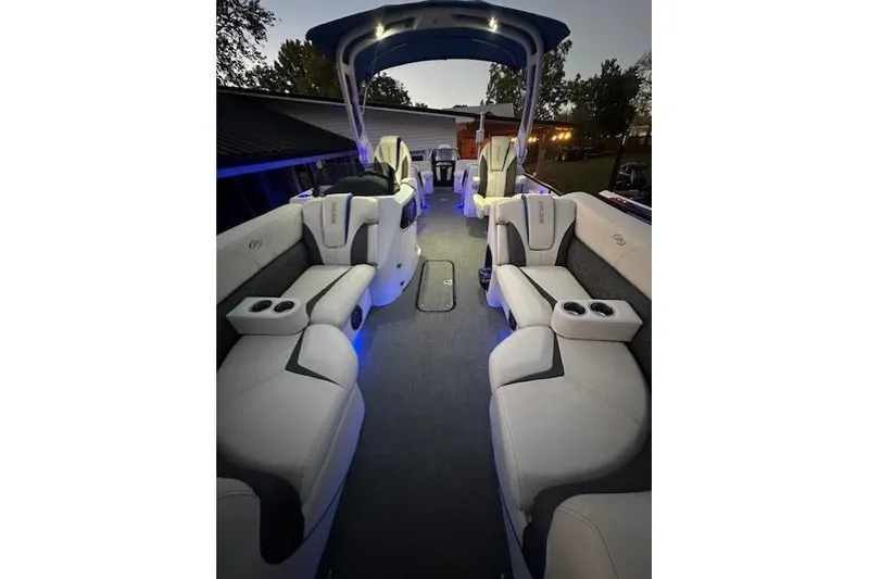 Slide: The Image of Luxurious interior of a 2020 Manitou 25 X-Plode RFW pontoon boat with ambient lighting. - 7