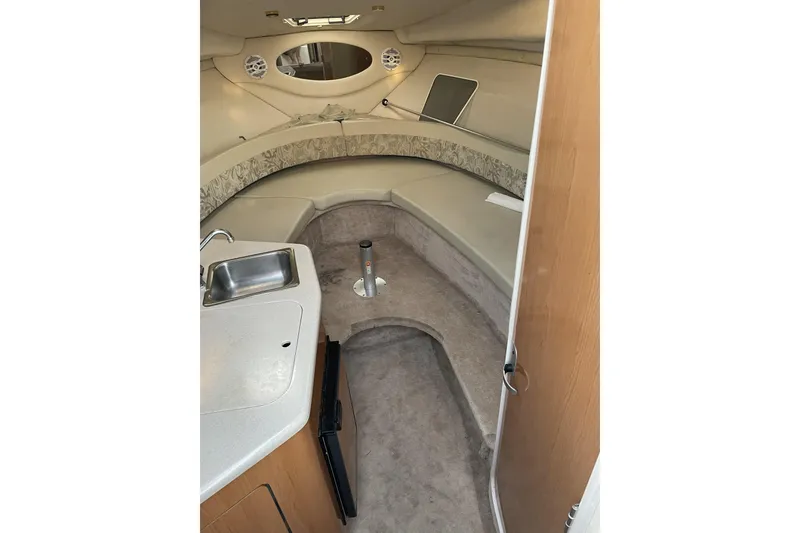 Slide: The Image of Interior of 2001 Regal Commodore 2660 boat with kitchenette and seating area. - 15