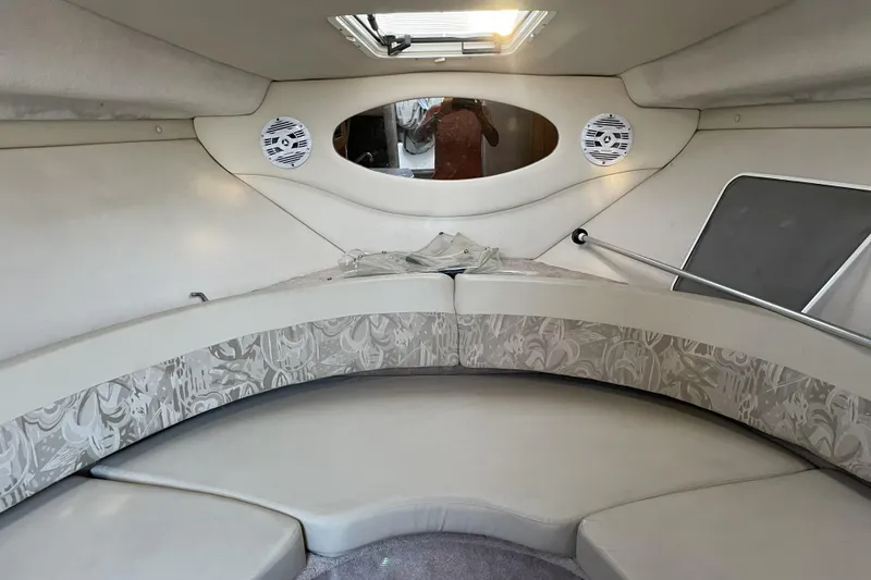 Slide: The Image of Interior cabin of 2001 Regal Commodore 2660 boat with seating and speakers. - 16