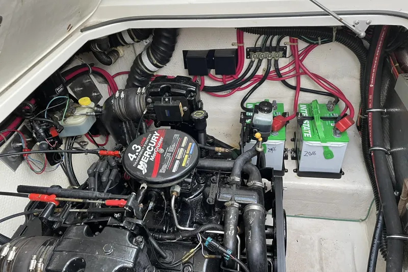 Slide: The Image of Engine compartment of a 2001 Regal Commodore 2660 with Mercury motor and batteries. - 22