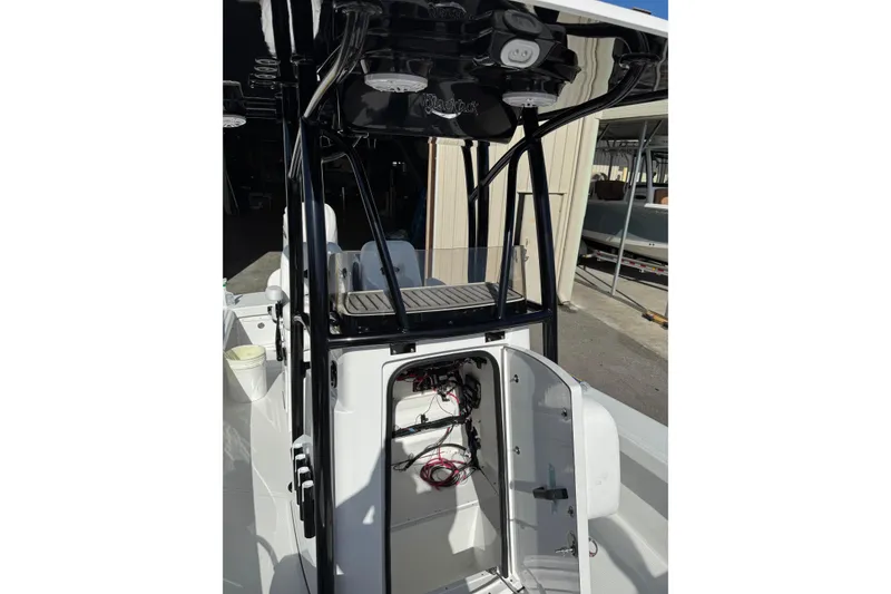 Slide: The Image of 2026 BlackJack 256 Coastal boat interior with seating and cup holders. - 11