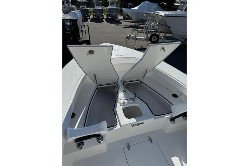 Slide: The Image of 2026 BlackJack 256 Coastal boat interior with white seating and K2 cooler. - 12