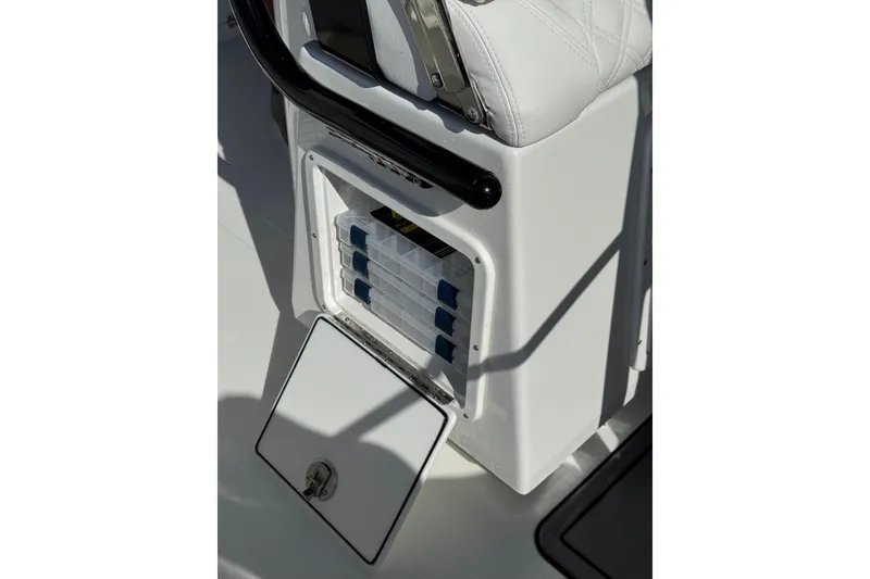 Slide: The Image of Open storage compartment on 2026 BlackJack 256 Coastal boat deck. - 17