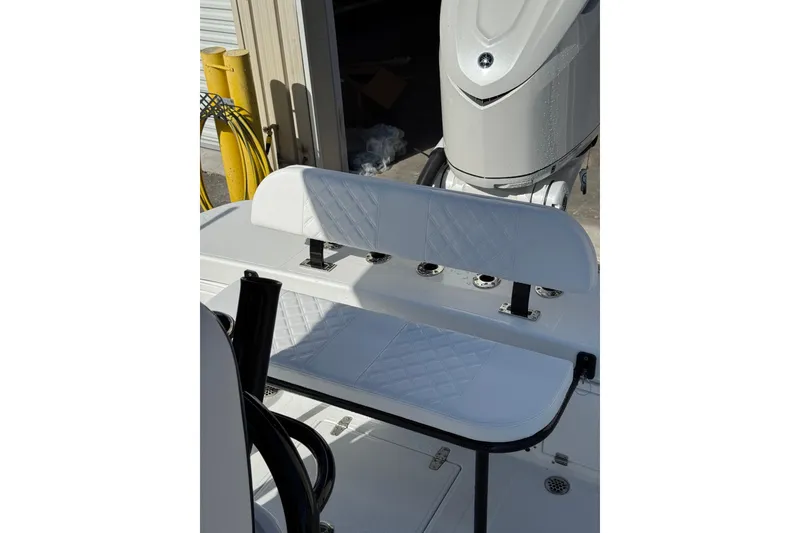 Slide: The Image of Open hatch with storage compartment on 2026 BlackJack 256 Coastal boat. - 20