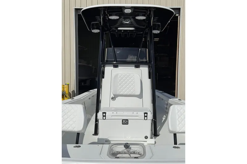Slide: The Image of T-top of 2026 BlackJack 256 Coastal boat with speakers and sleek design. - 6