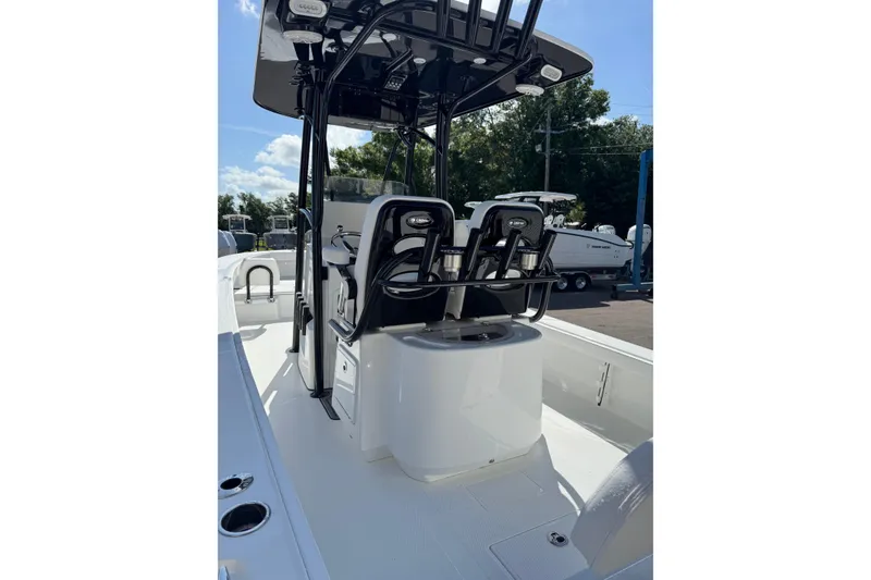 Slide: The Image of Open storage compartment on 2026 BlackJack 256 Coastal boat, featuring sleek black design. - 9