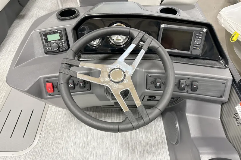 Slide: The Image of Steering console of 2026 Bennington 22 S Swingback boat with modern controls and displays. - 12