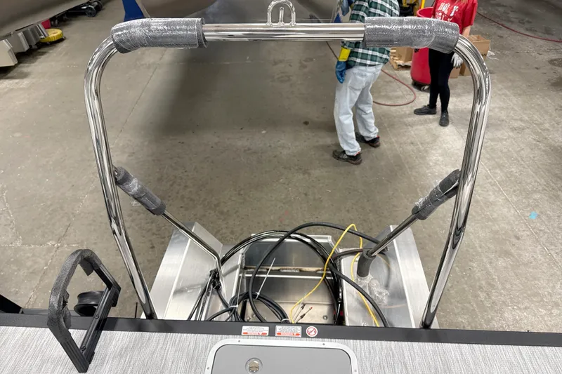 Slide: The Image of 2026 Bennington 22 S SWINGBACK boat ladder and deck in a workshop setting. - 17