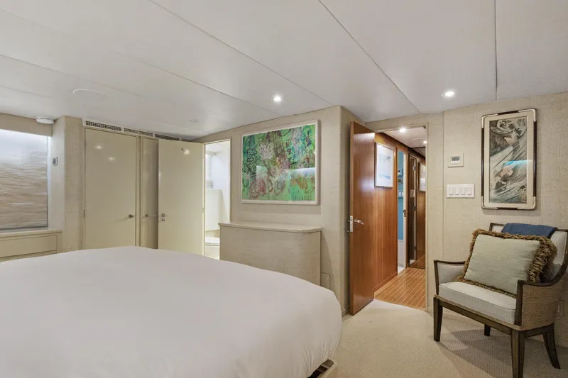 Slide: The Image of Luxurious yacht bedroom interior with modern decor, featuring artwork and comfortable seating, 1985 Burger model. - 14