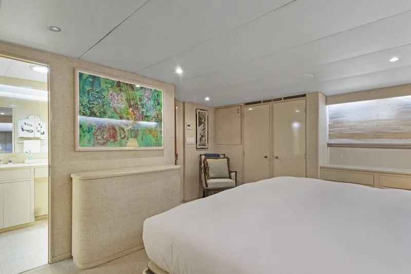 Slide: The Image of Luxurious bedroom interior on a 1985 Burger yacht, featuring elegant decor and modern amenities. - 15