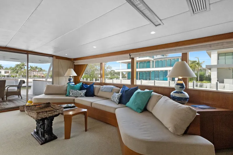 Slide: The Image of Luxurious 1985 Burger yacht interior with elegant seating, large windows, and stylish decor. - 2