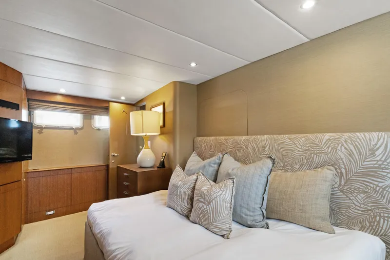 Slide: The Image of Luxurious 1985 Burger yacht bedroom with elegant decor and modern amenities. - 28