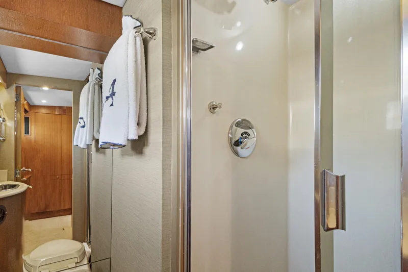 Slide: The Image of Luxurious 1985 Burger yacht bathroom with shower, towels, and wooden accents. - 33