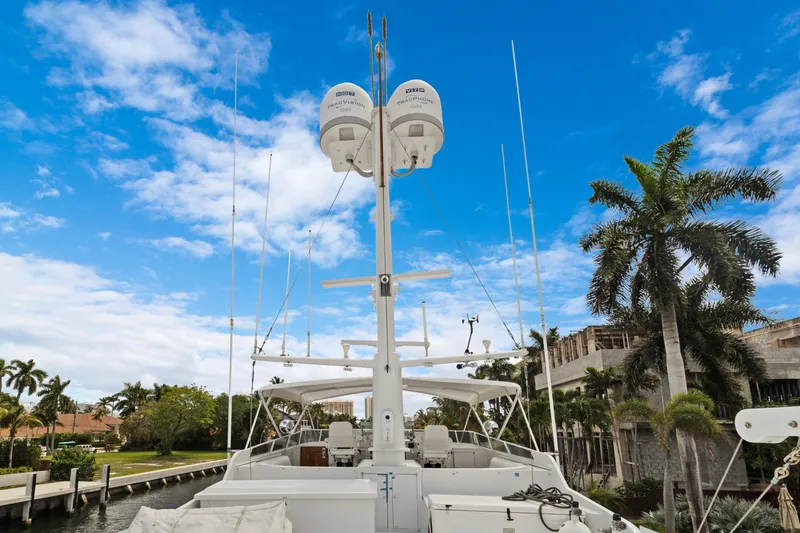 Slide: The Image of Luxury yacht deck with antennas, palm trees, and blue sky background. - 42