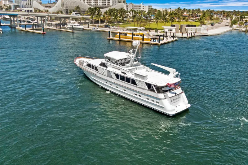 Slide: The Image of Luxury yacht "Burger 1985" cruising in a scenic marina setting. - 51
