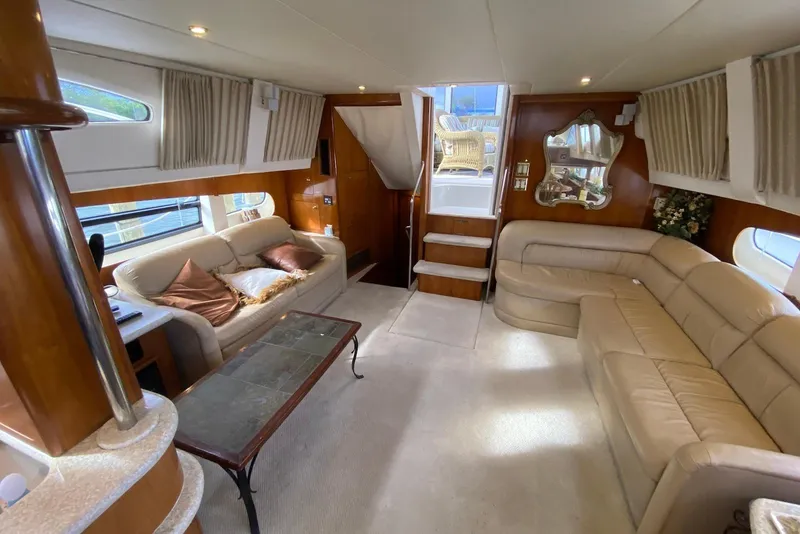 Slide: The Image of Luxurious interior of 2000 Carver 506 Motor Yacht with plush seating and elegant decor. - 15