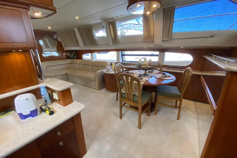 Slide: The Image of Luxurious interior of 2000 Carver 506 Motor Yacht with dining area and plush seating. - 19