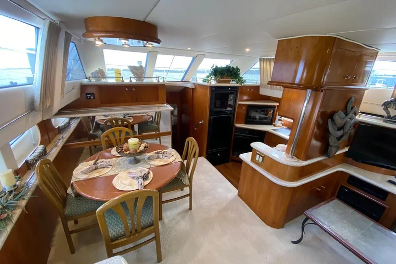 Slide: The Image of Interior of 2000 Carver 506 Motor Yacht with dining area and kitchen. - 20