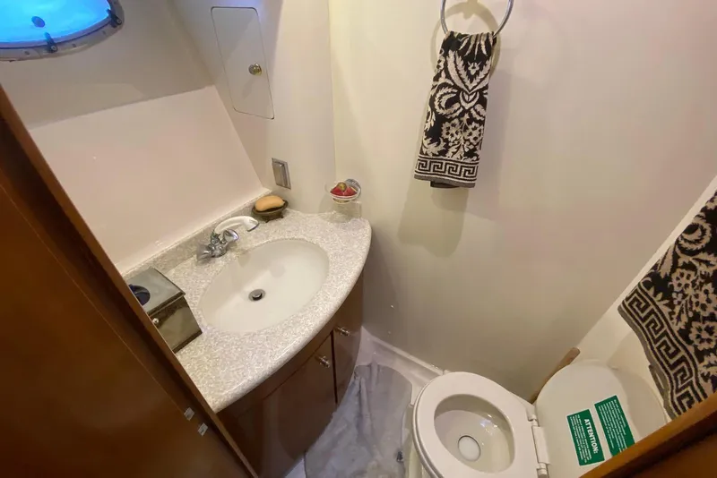 Slide: The Image of Bathroom interior of 2000 Carver 506 Motor Yacht with sink and toilet. - 26
