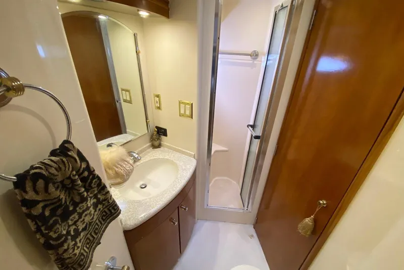 Slide: The Image of Bathroom interior of 2000 Carver 506 Motor Yacht with sink and shower. - 29