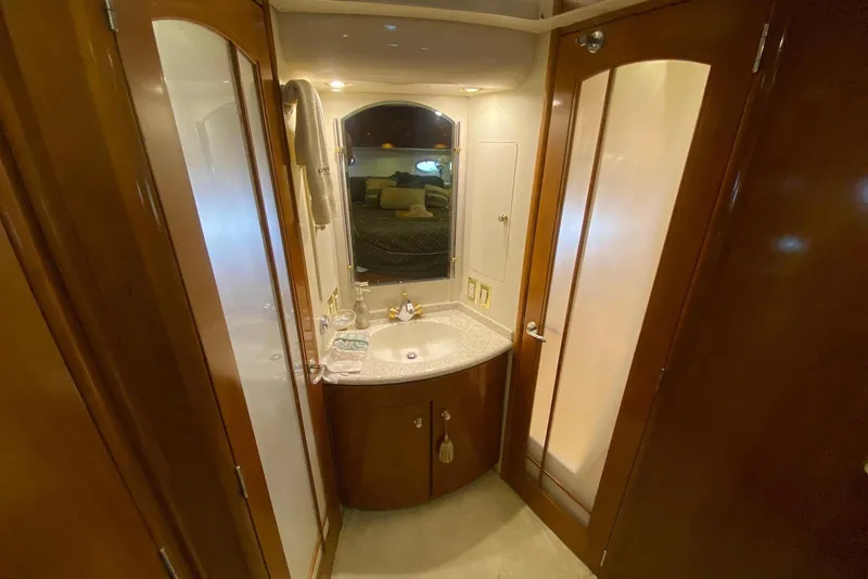Slide: The Image of Luxurious bathroom interior of 2000 Carver 506 Motor Yacht with elegant wood finishes. - 32