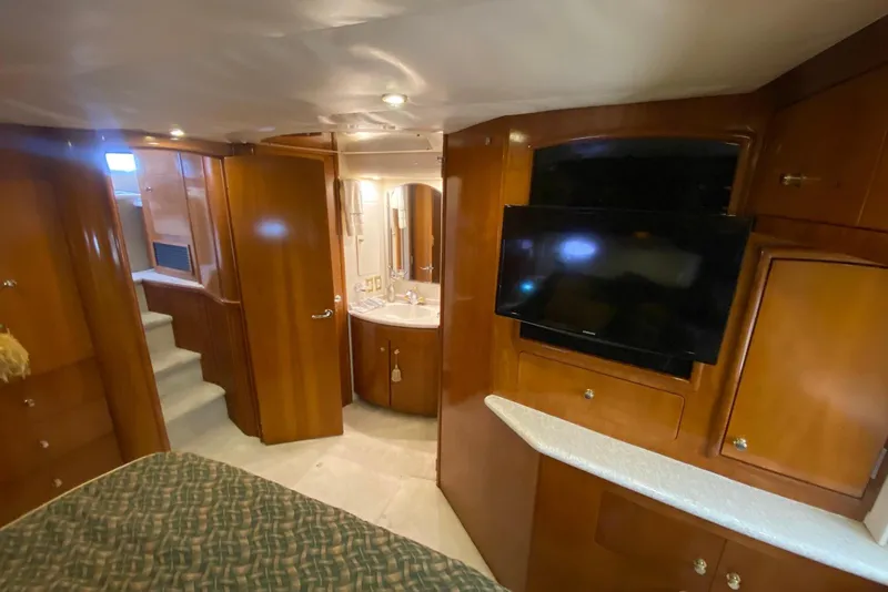 Slide: The Image of Interior of 2000 Carver 506 Motor Yacht with wood cabinetry and modern amenities. - 33