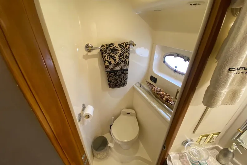 Slide: The Image of Bathroom interior of 2000 Carver 506 Motor Yacht with towel and window. - 37
