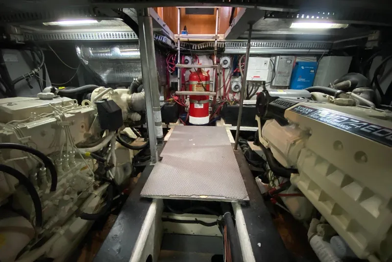 Slide: The Image of Engine room of a 2000 Carver 506 Motor Yacht, featuring dual engines and equipment. - 39