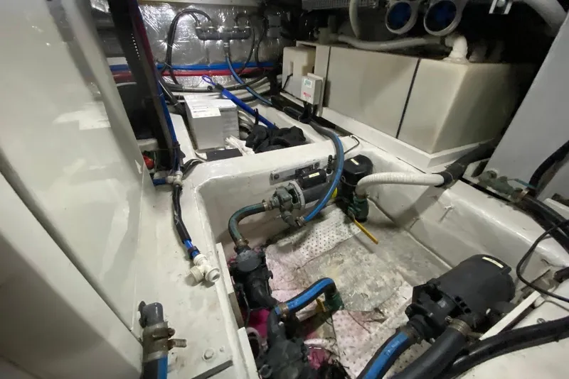 Slide: The Image of Engine room of a 2000 Carver 506 Motor Yacht with visible wiring and components. - 40