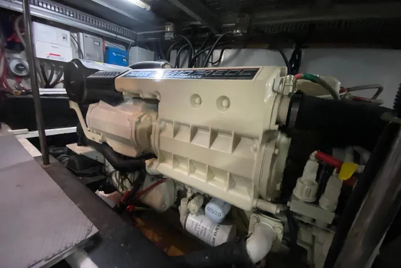 Slide: The Image of Engine room of a 2000 Carver 506 Motor Yacht, showcasing detailed machinery. - 44