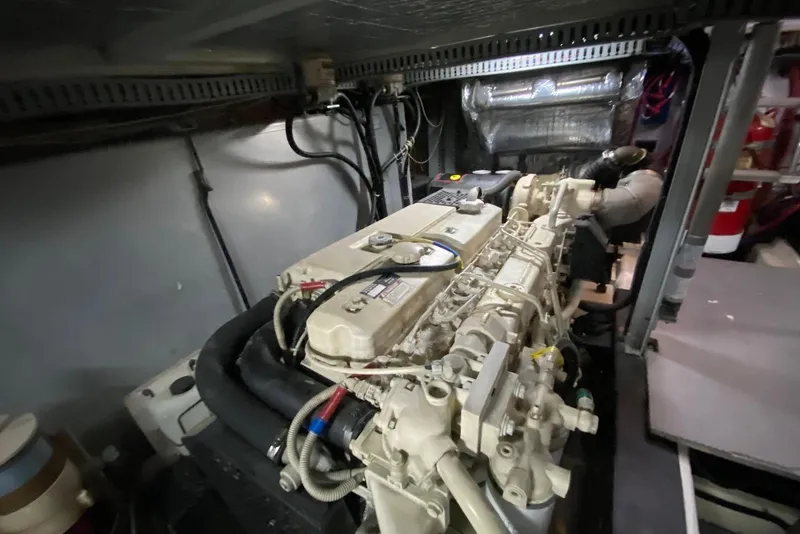 Slide: The Image of Engine room of a 2000 Carver 506 Motor Yacht, showcasing mechanical components. - 46