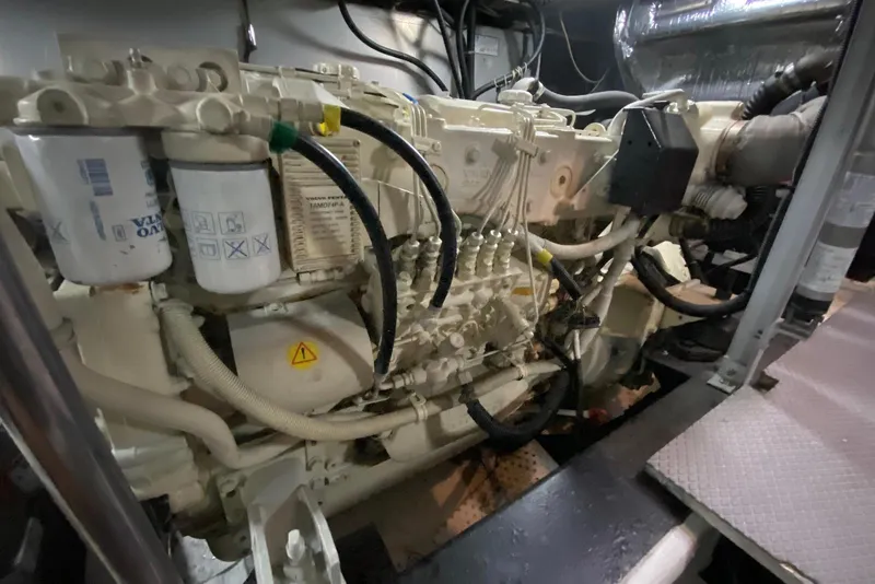 Slide: The Image of Engine room of a 2000 Carver 506 Motor Yacht, showcasing detailed machinery components. - 47
