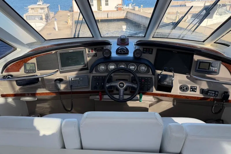 Slide: The Image of Helm of 2000 Carver 506 Motor Yacht with navigation instruments and steering wheel. - 9