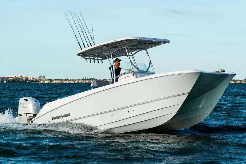 The Image of Manufacturer Provided Image: 2026 Twin Vee 240 STX CC boat cruising on open water, featuring a sleek design. - 0